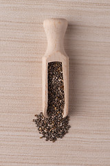 Image showing Wooden scoop with chia seeds
