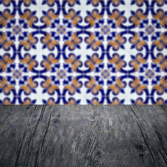 Image showing Wood table top and blur vintage ceramic tile pattern wall