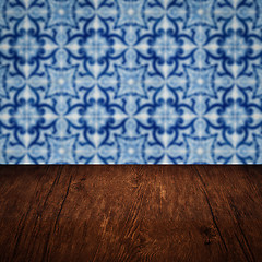 Image showing Wood table top and blur vintage ceramic tile pattern wall