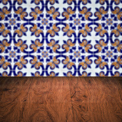 Image showing Wood table top and blur vintage ceramic tile pattern wall