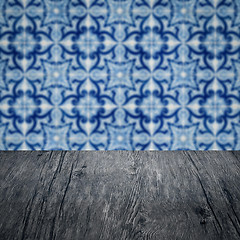 Image showing Wood table top and blur vintage ceramic tile pattern wall