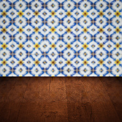 Image showing Wood table top and blur vintage ceramic tile pattern wall