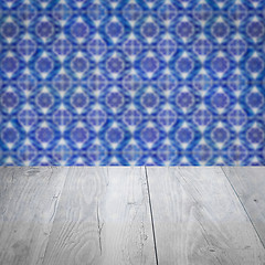 Image showing Wood table top and blur vintage ceramic tile pattern wall