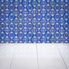 Image showing Wood table top and blur vintage ceramic tile pattern wall