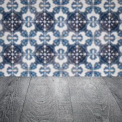 Image showing Wood table top and blur vintage ceramic tile pattern wall