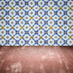 Image showing Wood table top and blur vintage ceramic tile pattern wall