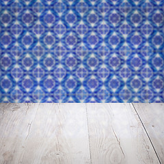 Image showing Wood table top and blur vintage ceramic tile pattern wall