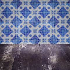 Image showing Wood table top and blur vintage ceramic tile pattern wall