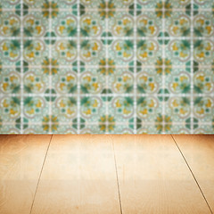 Image showing Wood table top and blur vintage ceramic tile pattern wall