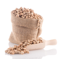 Image showing Uncooked chickpeas and wooden scoop