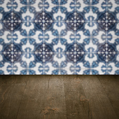 Image showing Wood table top and blur vintage ceramic tile pattern wall