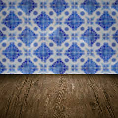 Image showing Wood table top and blur vintage ceramic tile pattern wall