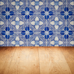 Image showing Wood table top and blur vintage ceramic tile pattern wall