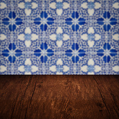 Image showing Wood table top and blur vintage ceramic tile pattern wall