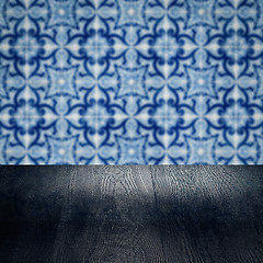 Image showing Wood table top and blur vintage ceramic tile pattern wall