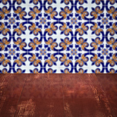 Image showing Wood table top and blur vintage ceramic tile pattern wall