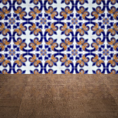 Image showing Wood table top and blur vintage ceramic tile pattern wall