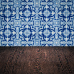 Image showing Wood table top and blur vintage ceramic tile pattern wall