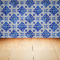 Image showing Wood table top and blur vintage ceramic tile pattern wall