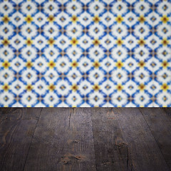 Image showing Wood table top and blur vintage ceramic tile pattern wall