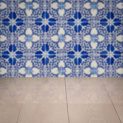 Image showing Wood table top and blur vintage ceramic tile pattern wall