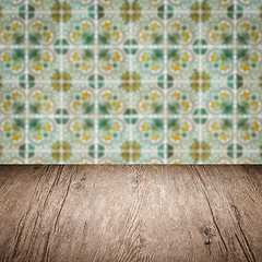 Image showing Wood table top and blur vintage ceramic tile pattern wall