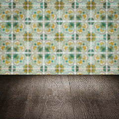 Image showing Wood table top and blur vintage ceramic tile pattern wall