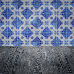 Image showing Wood table top and blur vintage ceramic tile pattern wall