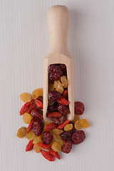 Image showing Wooden scoop with mixed dried fruits