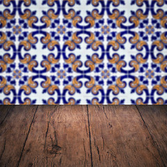 Image showing Wood table top and blur vintage ceramic tile pattern wall