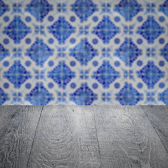 Image showing Wood table top and blur vintage ceramic tile pattern wall