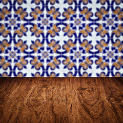 Image showing Wood table top and blur vintage ceramic tile pattern wall