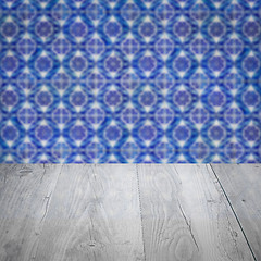 Image showing Wood table top and blur vintage ceramic tile pattern wall