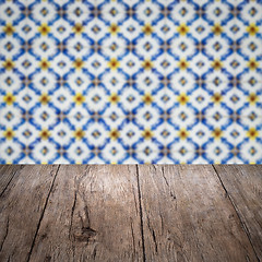 Image showing Wood table top and blur vintage ceramic tile pattern wall