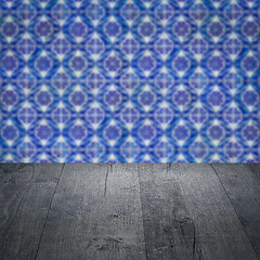 Image showing Wood table top and blur vintage ceramic tile pattern wall