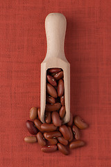 Image showing Wooden scoop with red beans