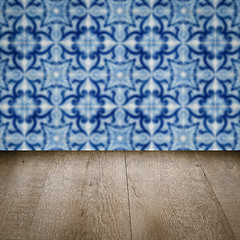 Image showing Wood table top and blur vintage ceramic tile pattern wall