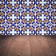 Image showing Wood table top and blur vintage ceramic tile pattern wall