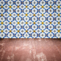 Image showing Wood table top and blur vintage ceramic tile pattern wall