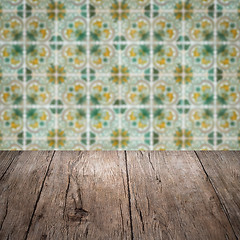 Image showing Wood table top and blur vintage ceramic tile pattern wall