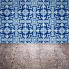 Image showing Wood table top and blur vintage ceramic tile pattern wall