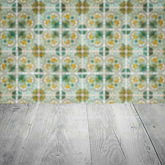 Image showing Wood table top and blur vintage ceramic tile pattern wall