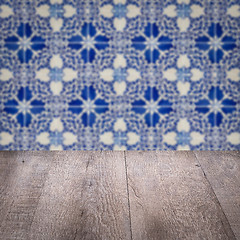 Image showing Wood table top and blur vintage ceramic tile pattern wall