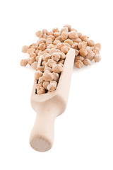 Image showing Uncooked chickpeas and wooden scoop