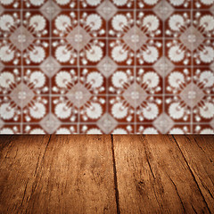 Image showing Wood table top and blur vintage ceramic tile pattern wall