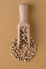 Image showing Wooden scoop with white beans