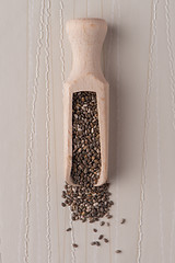 Image showing Wooden scoop with chia seeds