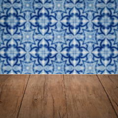 Image showing Wood table top and blur vintage ceramic tile pattern wall