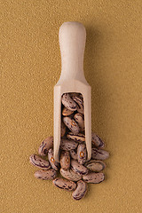 Image showing Wooden scoop with pinto beans