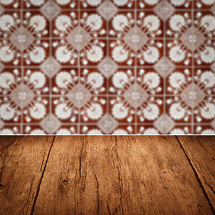 Image showing Wood table top and blur vintage ceramic tile pattern wall